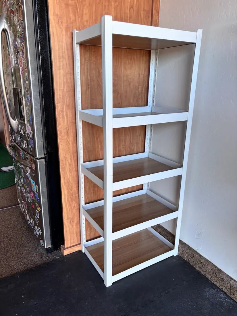 Five-tier steel shelving unit in a garage