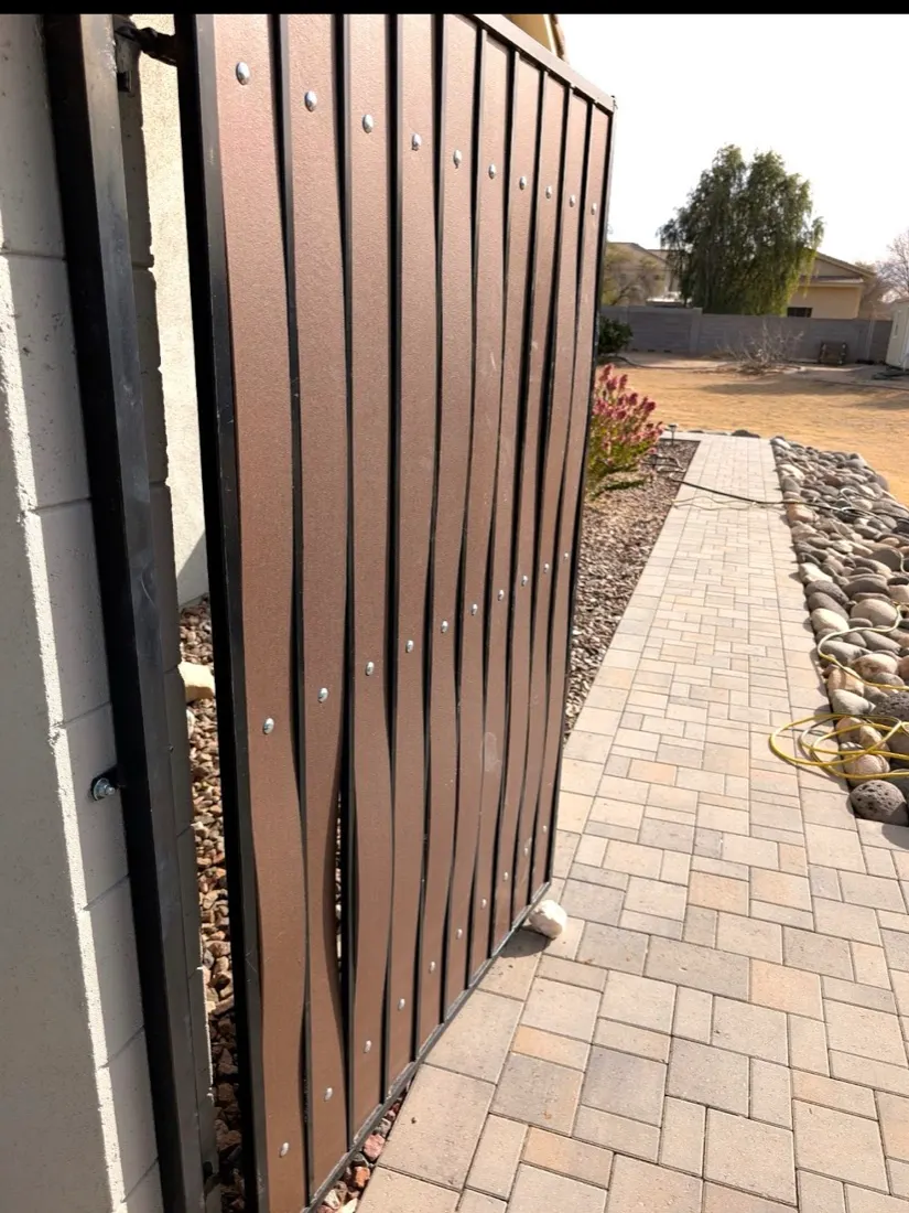 Warped composite slats on a gate with only 3 anchor points, why we prefer real redwood or cedar
