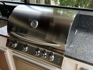 Built-in stainless steel outdoor kitchen grill polished after cleaning