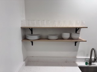 Open shelving installed in an office break room