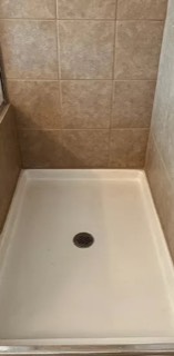 Rust and hard water stains removed from a shower pan