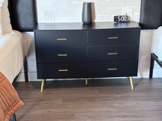 Six-drawer dresser with gold legs and pulls