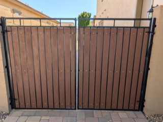 Double side gate with new brown slats and a repainted black frame