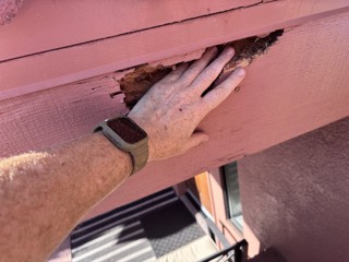 Rotted hole in a fascia board spotted on an exterior walk-around