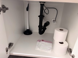 Under-sink leak check of the drain and supply lines