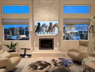 TV mounted above a fireplace with hidden wires
